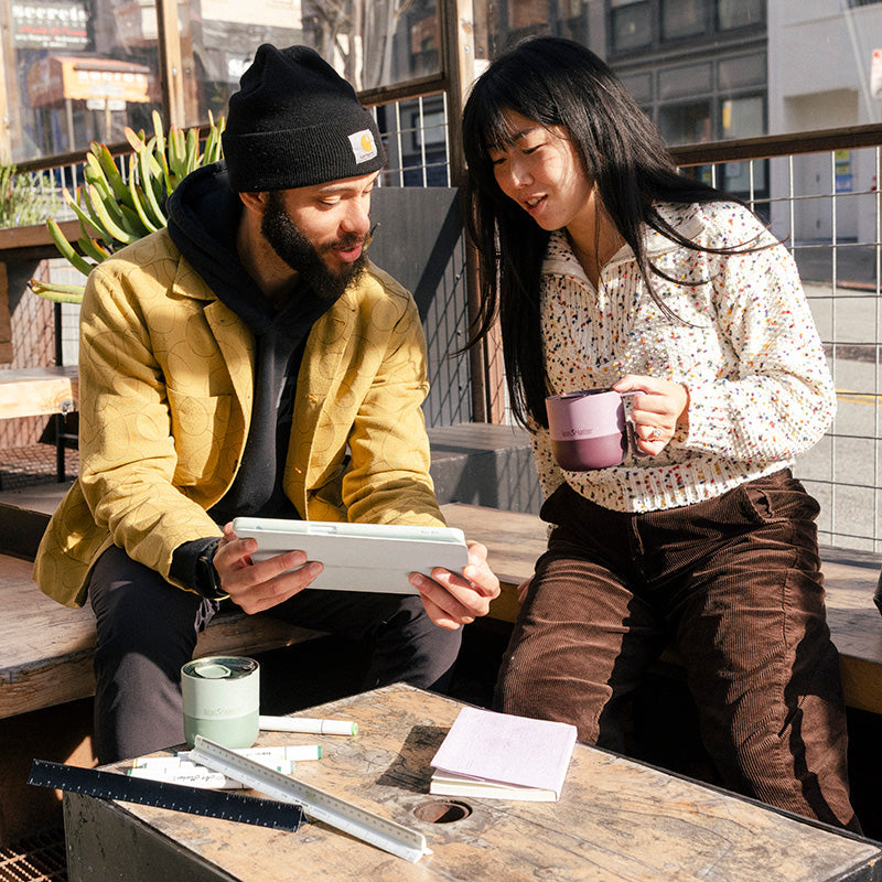 12oz-rise-mug-f0 12oz_rise_coffee_mug_dusty_orchid_couple_city_patio_square.jpg