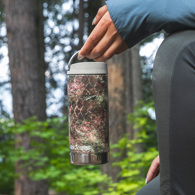 12oz-tkwide-with-twist-cap-mossy-oak-a1 12oz_tumbler_mossyoak_rainbowtrout_hand_closeup_square.jpg