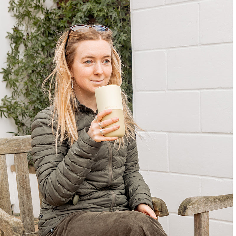16oz-rise-tumbler-b3 16oz_rise_tumbler_wax_yellow_woman_seat_outside_square.jpg